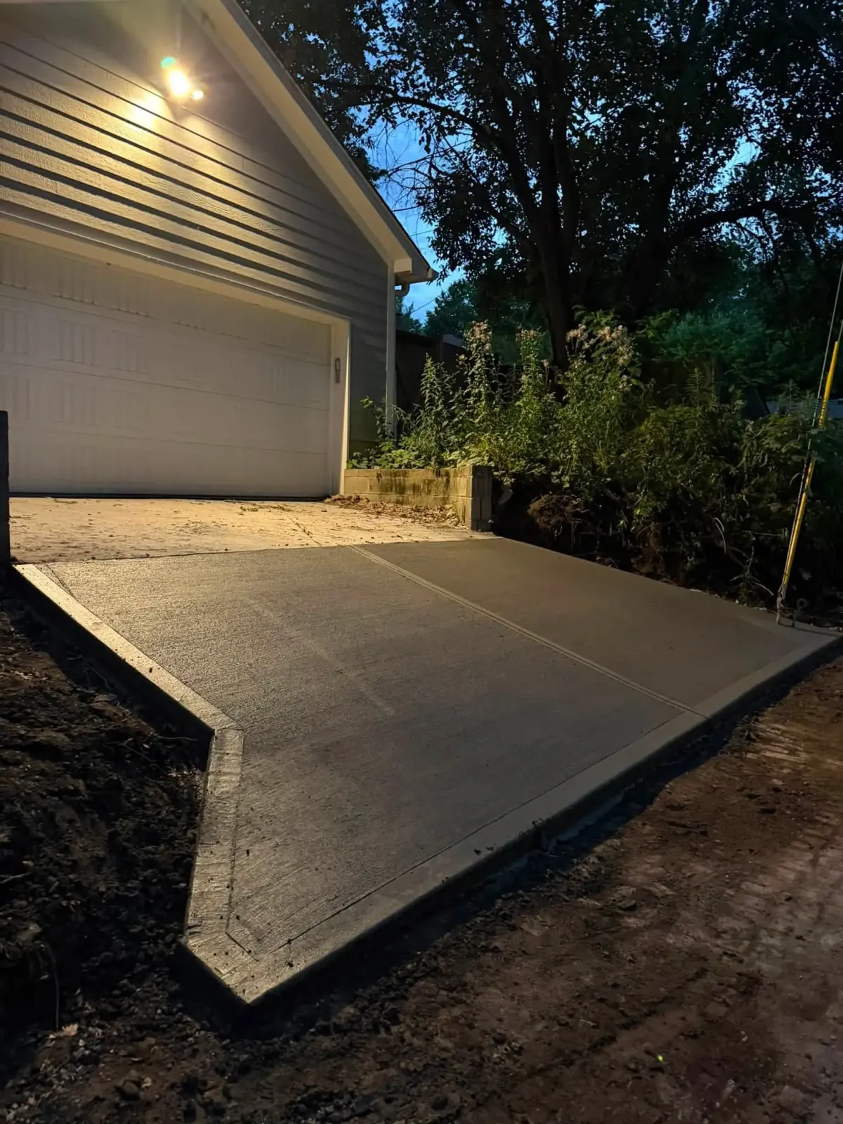 Daytime residential driveway and entry with broom finish